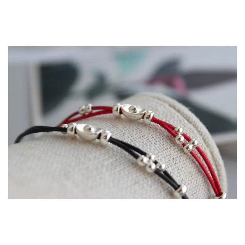 Pulsera de cordón rojo con lingote
