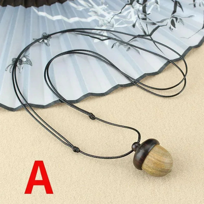 Novo criativo colar pinha retro ébano bolota pingente caixa arte design colar pingente rotativo desejando garrafa acessório