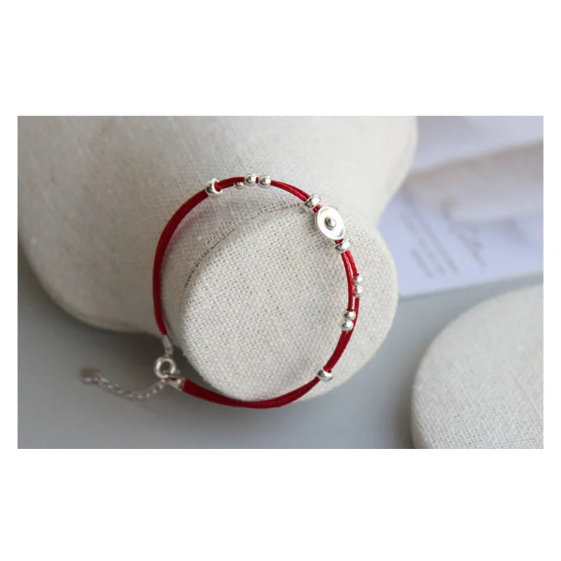 Pulsera de cordón rojo con lingote