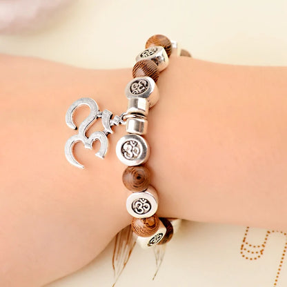 Pulsera Om · Cuentas y Colgante