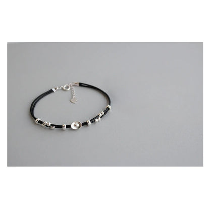 Pulsera de cordón rojo con lingote