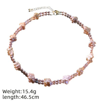 Conjunto de collar y pulsera de perlas y trébol