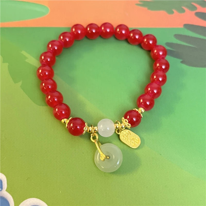 Pulsera Carmesí · Cuentas y Colgante