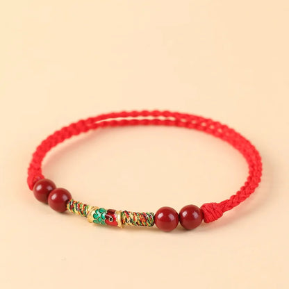 Pulsera roja con pez koi decorativo