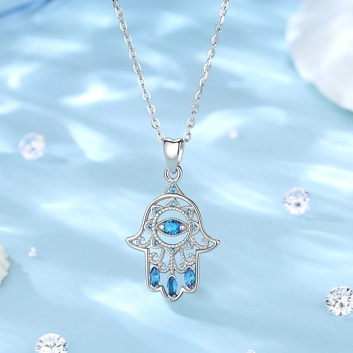 Colgante Hamsa con cristal azul