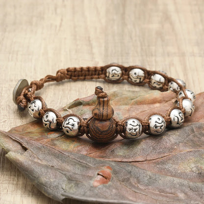 Pulsera Calabaza: Cuentas y Símbolos. Diseño y acabado de la pieza mostrada.