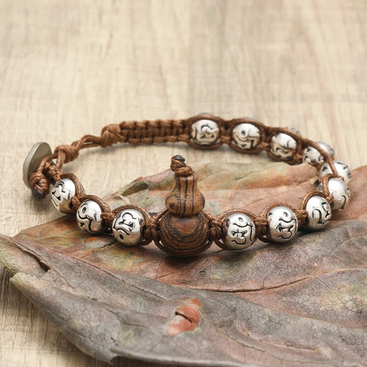 Pulsera Calabaza: Cuentas y Símbolos. Diseño y acabado de la pieza mostrada.