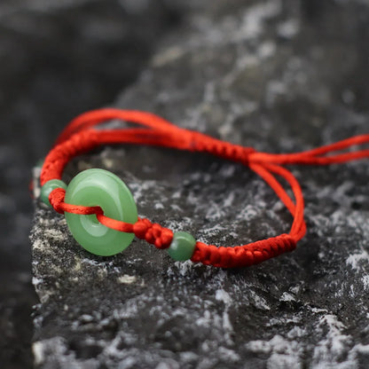 Pulsera roja con círculo de imitación jade