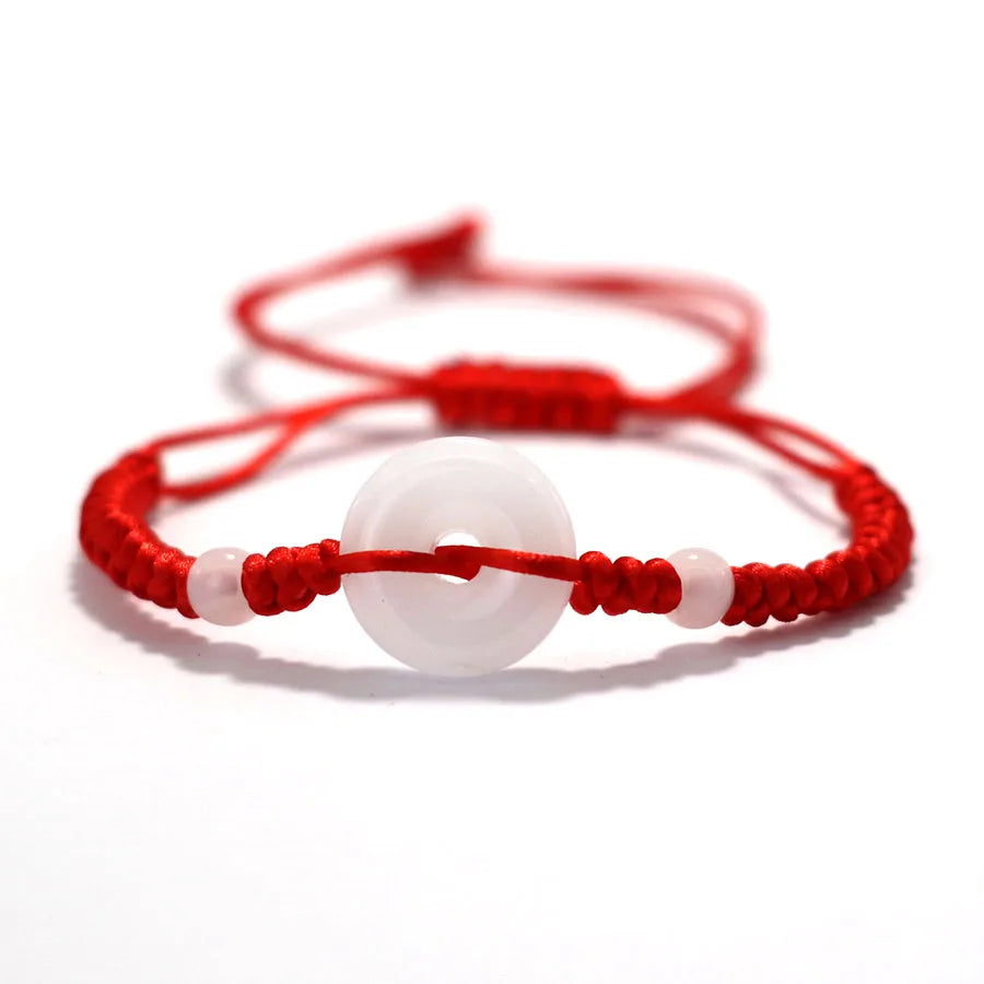 Pulsera roja con círculo de imitación jade