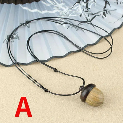 Novo criativo colar pinha retro ébano bolota pingente caixa arte design colar pingente rotativo desejando garrafa acessório