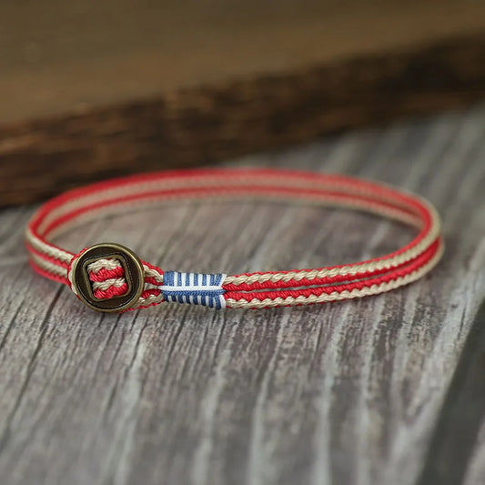 Pulsera Trazo Fino: Cordón Bicolor. Diseño y acabado de la pieza mostrada.