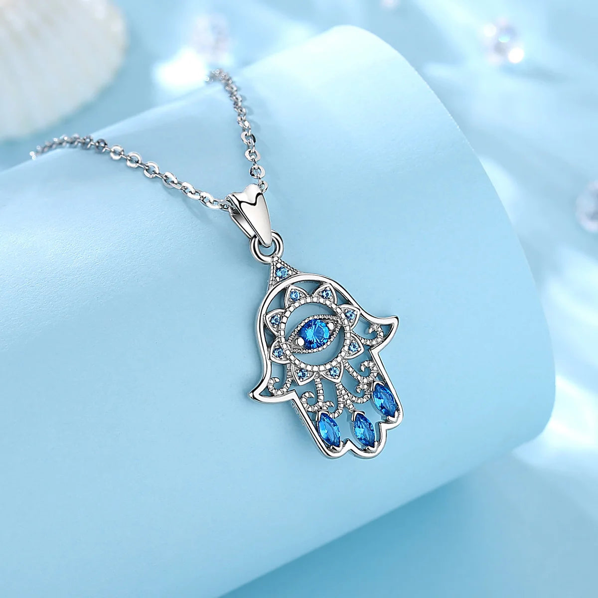 Colgante Hamsa con cristal azul