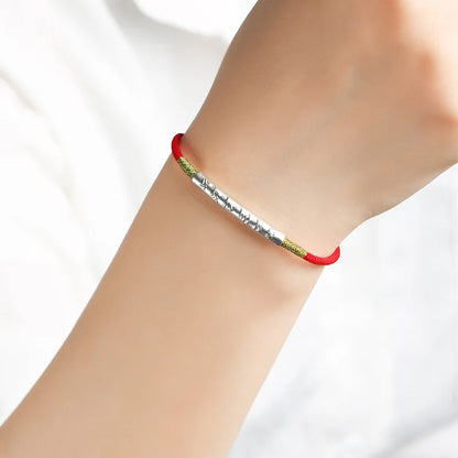 Pulsera de cordón rojo con mantra tibetano