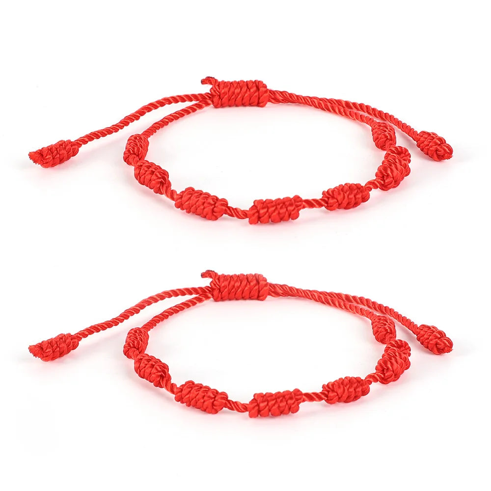 Pulsera roja trenzada con cuenta central