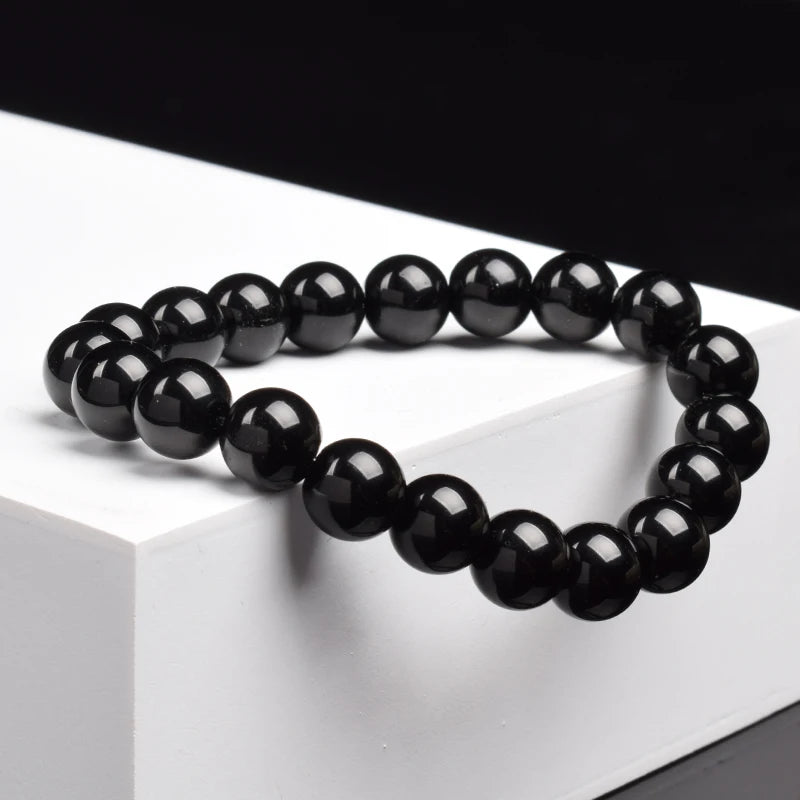 Pulsera Umbra · Cuentas Pulidas
