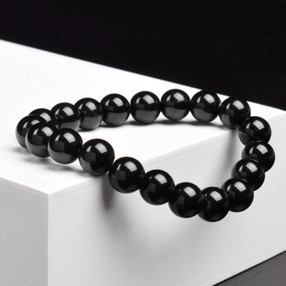 Pulsera Umbra · Cuentas Pulidas