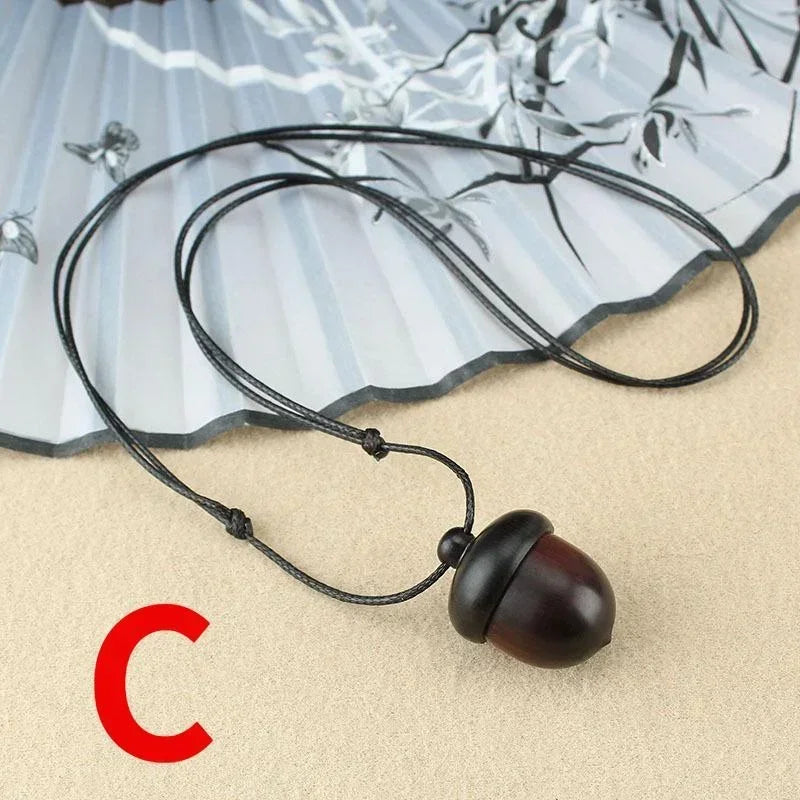 Novo criativo colar pinha retro ébano bolota pingente caixa arte design colar pingente rotativo desejando garrafa acessório