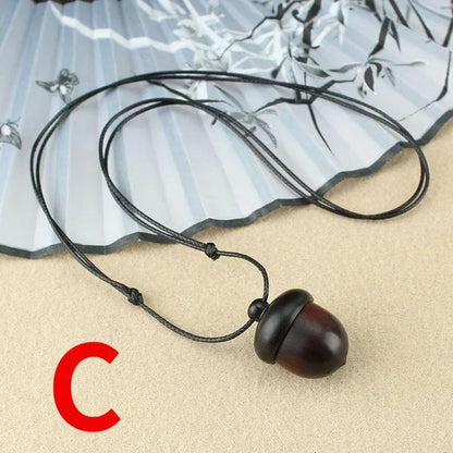 Novo criativo colar pinha retro ébano bolota pingente caixa arte design colar pingente rotativo desejando garrafa acessório