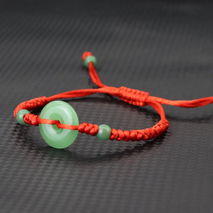 Pulsera roja con círculo de imitación jade